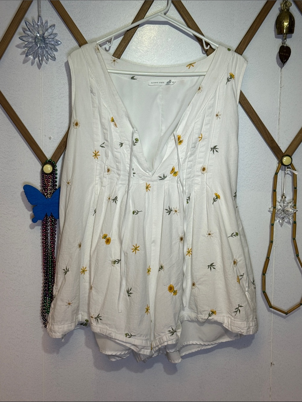 Altar'd State White Sleeveless V-Neck Romper with Yellow Floral Embroidery